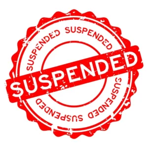 A red stamp that says suspended on it