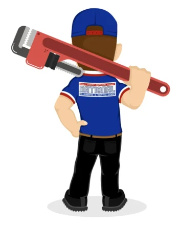 alt="A plumber is holding a large wrench over his shoulder."